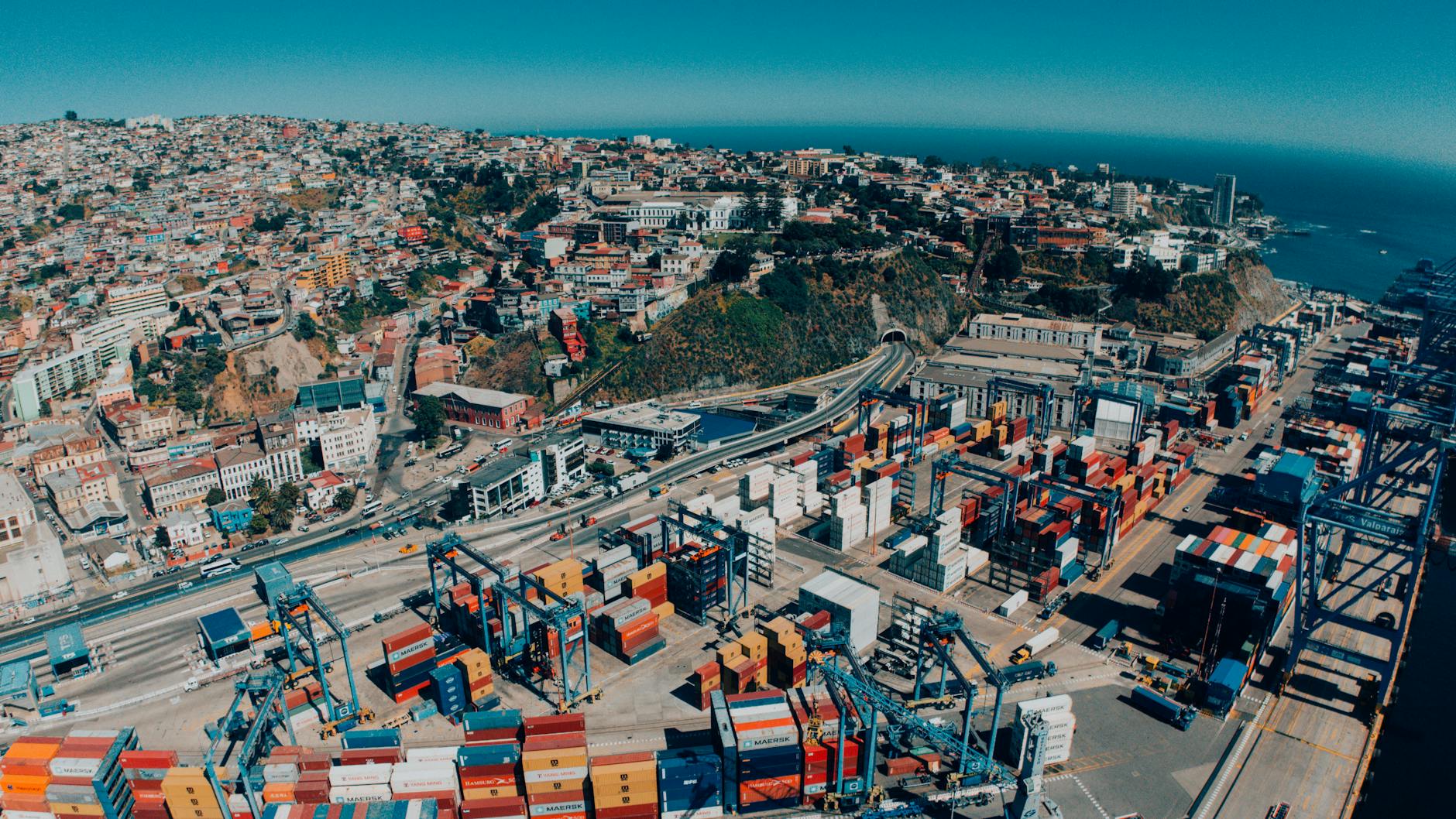 Explore a vibrant aerial view of Valparaíso, Chile, showcasing its bustling harbor and colorful hillside architecture.